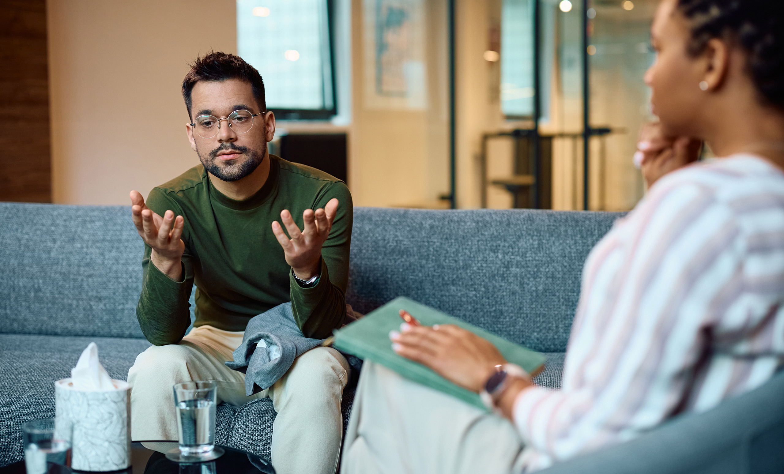 Picture of a man talking with his therapist during a private session.