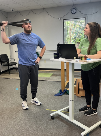 Patient performing physical therapy neck exercises to speed recovery at Adler Therapy Group Virginia Beach Newtown